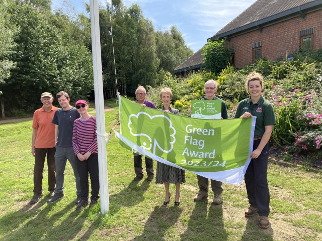 A photo of Brocks Hill volunteers and our park ranger and CEO with the Green Flag for 2023/24
