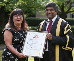 Oadby & Wigston Mayor Lily Kaufman presenting Professor Nishan Canagarajah, President and Vice-Chancellor with a certificate marking the conferral of Freedom of the Borough