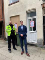 PC 2939 Richard Smith of Leicestershire Police (L) and Thomas Maccabe, the Council’s Anti-Social Behaviour Officer (R) outside the closed property at Station Street, South Wigston
